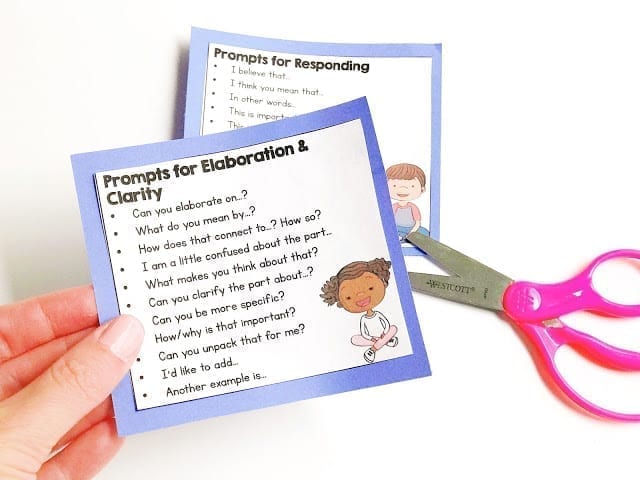 Prompt cards showing different verbal prompts and images of a girl and boy with a pair of pink Westcott brand scissors