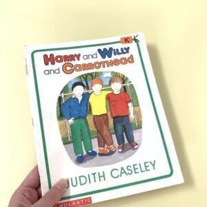 Cover of Harry and Willy and Carrothead showing three boys on the cover. One of the boys is disabled with a prosthetic hand. 