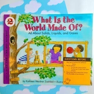 What is the World Made Of book cover with Ask & Answer Questions sticky note on bottom right of book