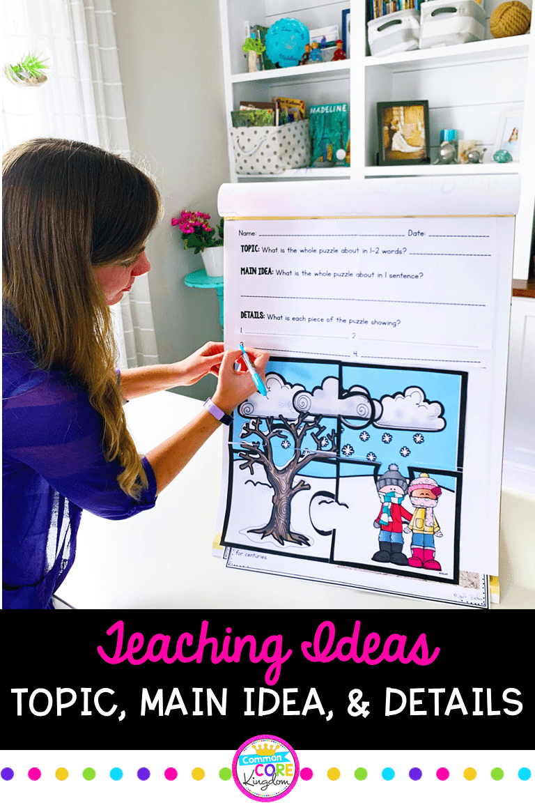 Teacher writing details on a main idea poster that has a main idea puzzle displayed