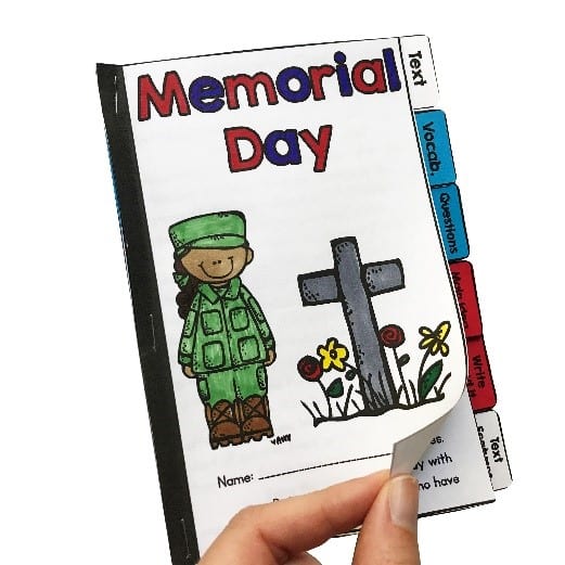 Teaching about memorial day for elementary students guided reader showing a hand turning the page of a differentiated booklet.